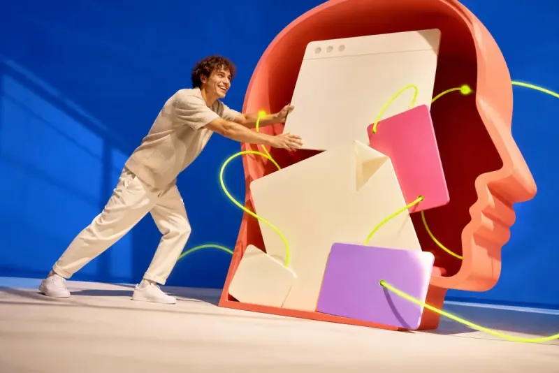 A founder feeding blank web, document and campaign cards into a sculptural coral knowledge portal